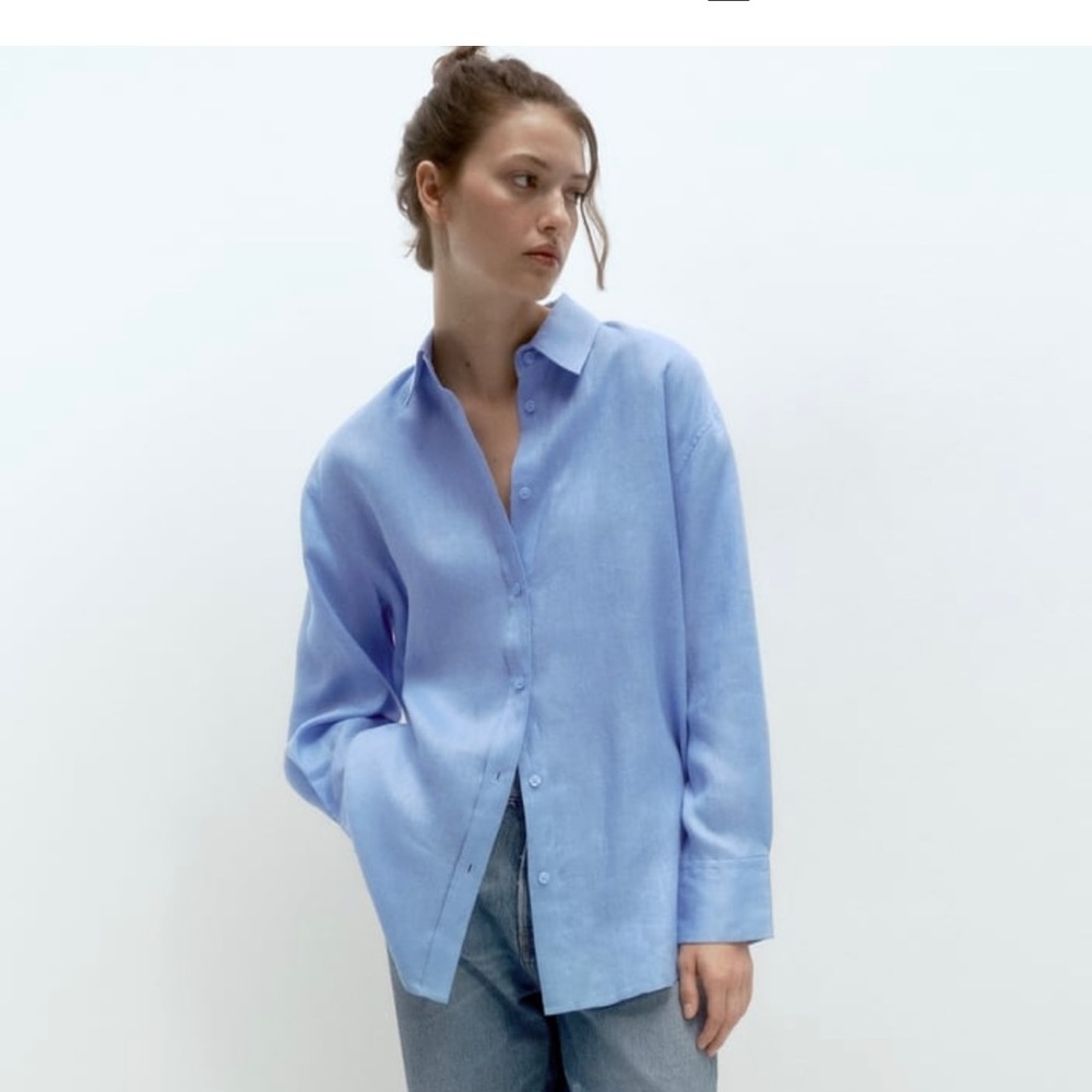 Gorgeous blue linen blouse by Zara. Brand new with tag. Size medium.